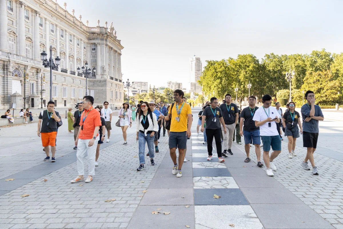CUHK EMBA participants walking outside Madrid’s Royal Palace during their 2024 study trip to Spain.