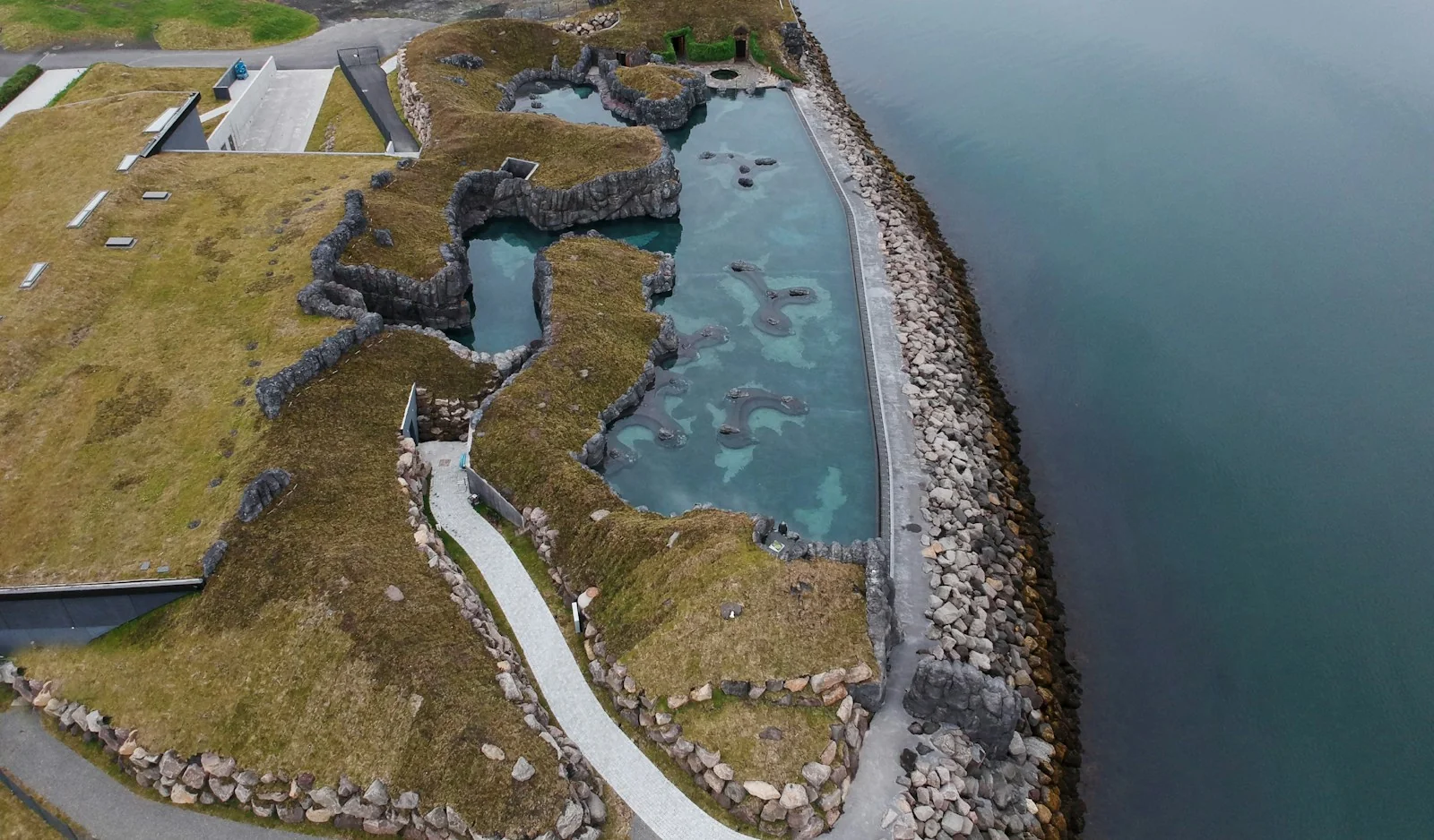 Sky Lagoon in Kópavogur, Iceland, with its oceanfront infinity pool, basalt walls and turf roofs