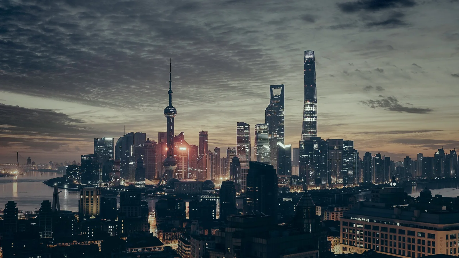 Shanghai’s Pudong skyline across the Huangpu River at dusk
